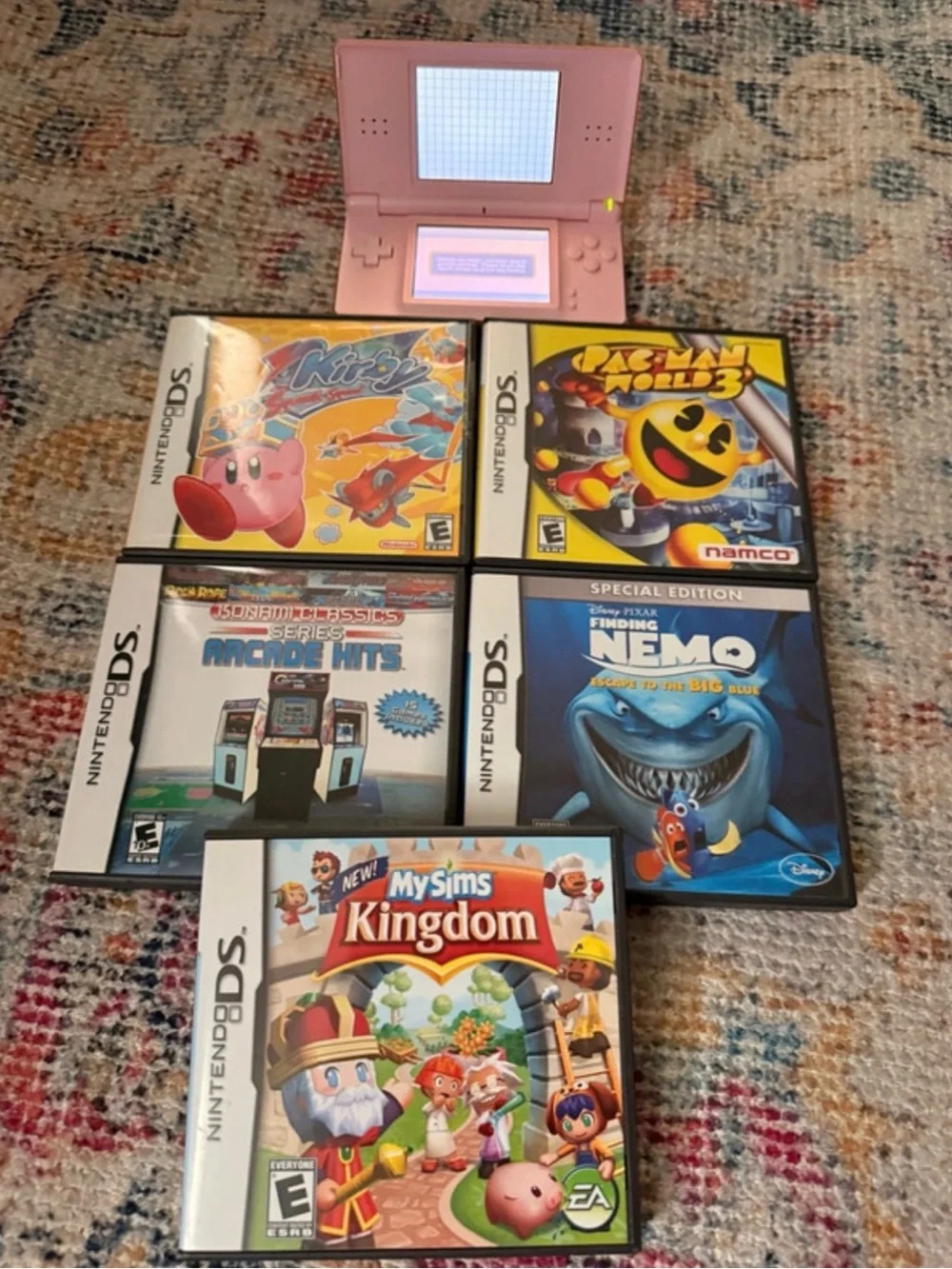 Nintendo Pink DS Lite Handheld with Five Nintendo DS Game Cases